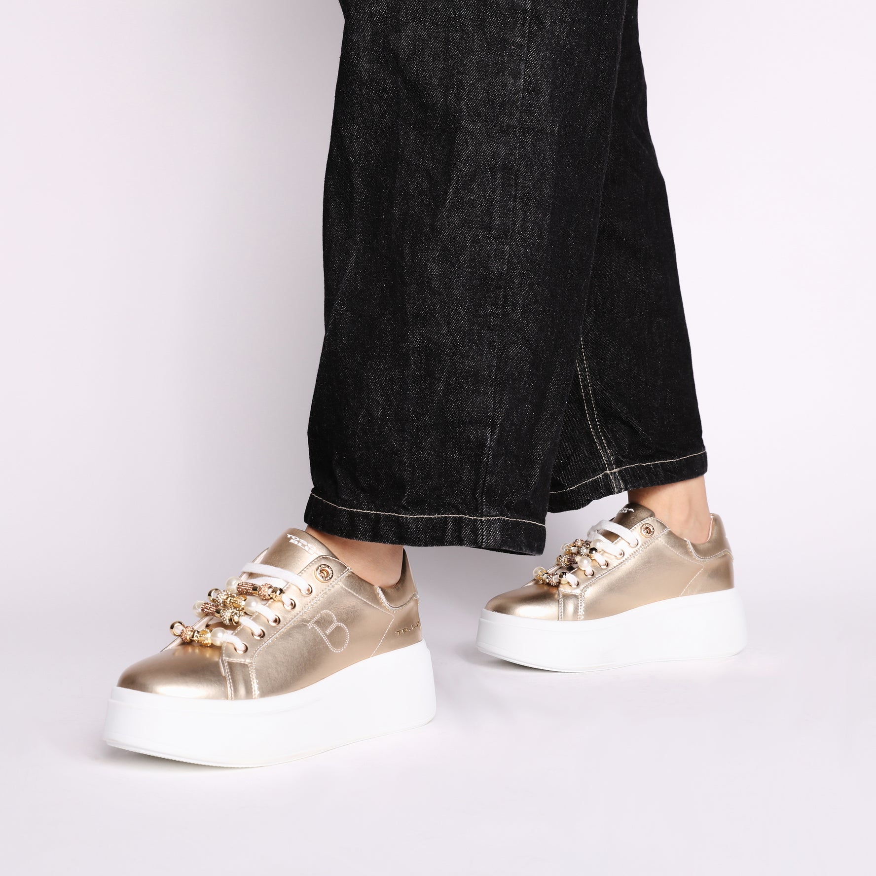 Clara leather sneakers with gold-colored accessories